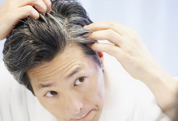 photolibrary_rf_photo_of_man_looking_at_gray_hair